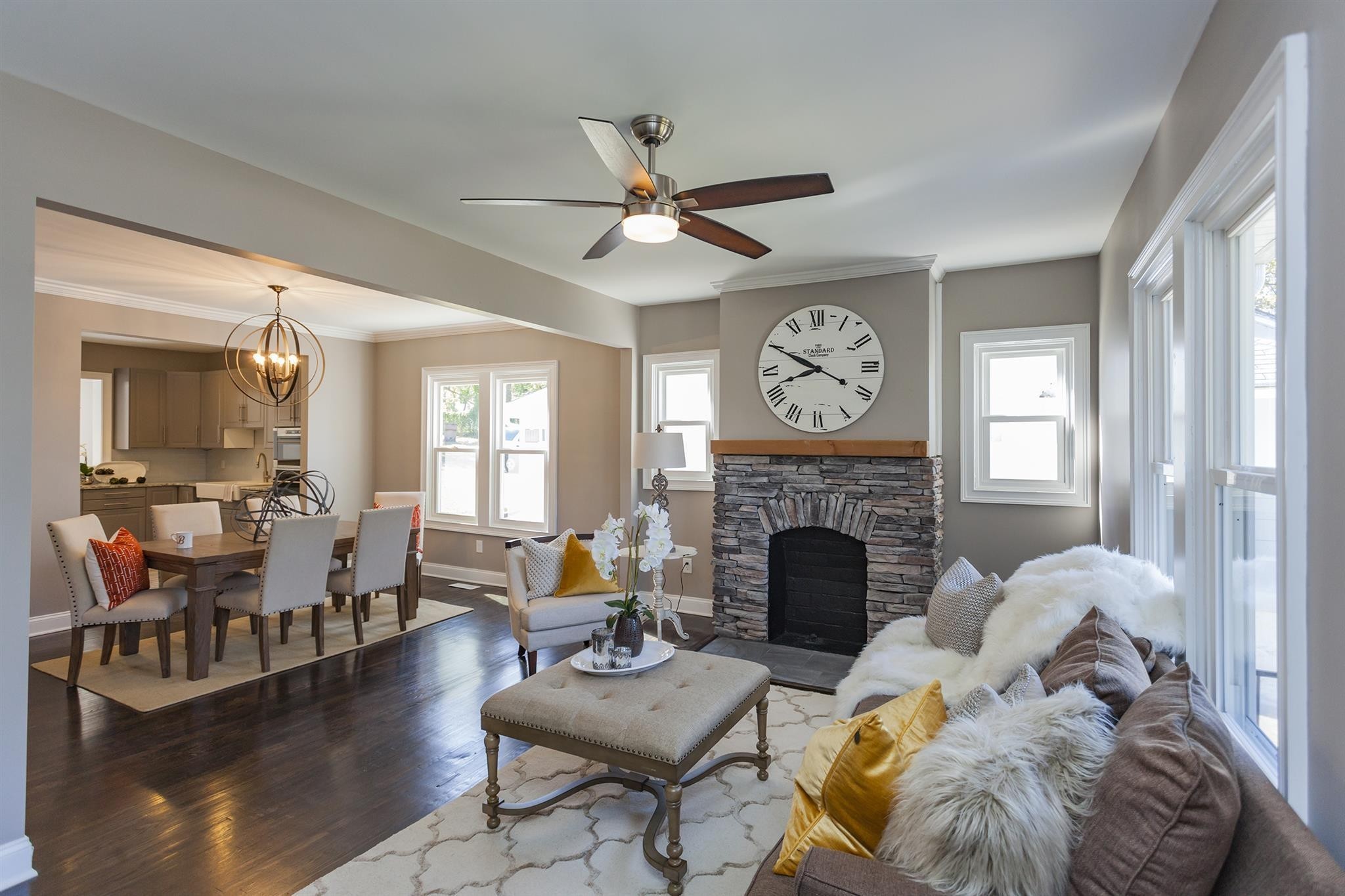 a living room with furniture and a fireplace