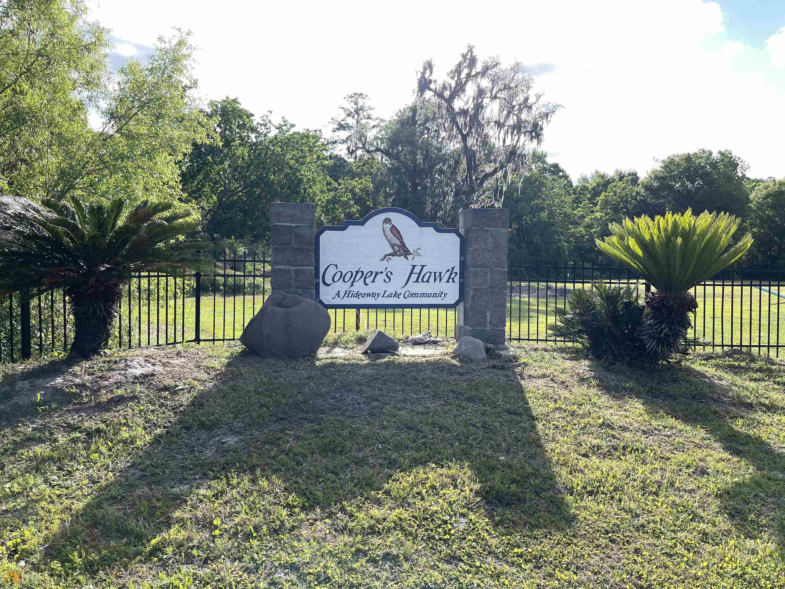 a sign board with yard in front of it