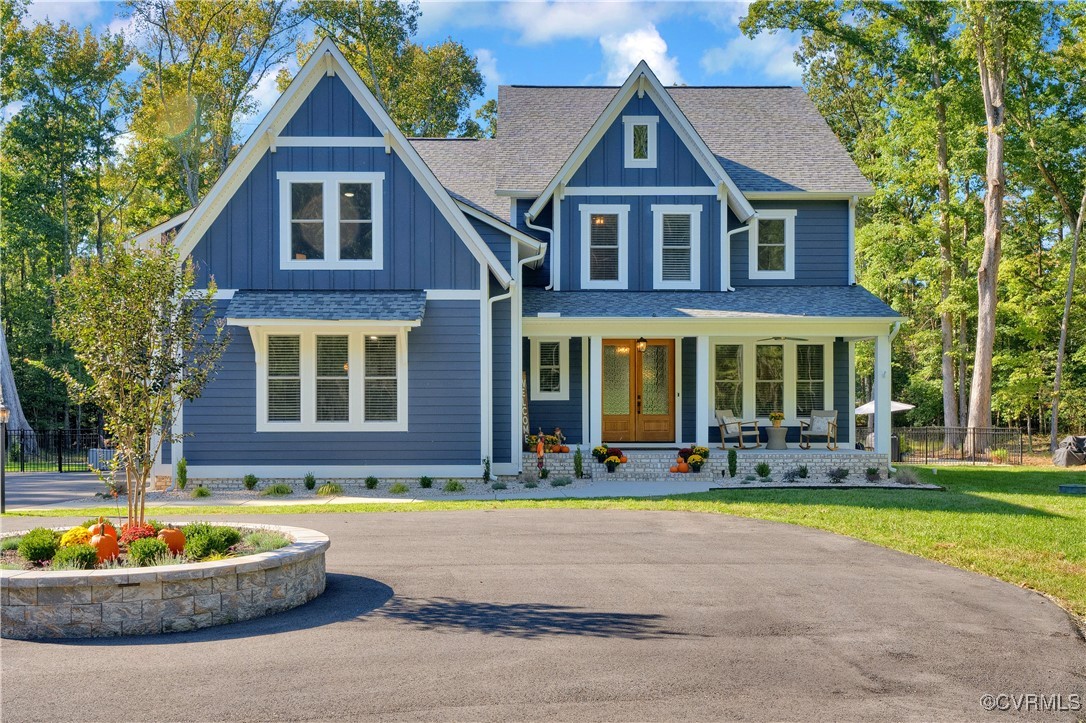 a front view of a house with a yard and outdoor seating