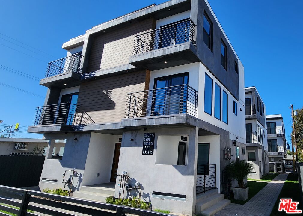 a front view of a building with sitting area