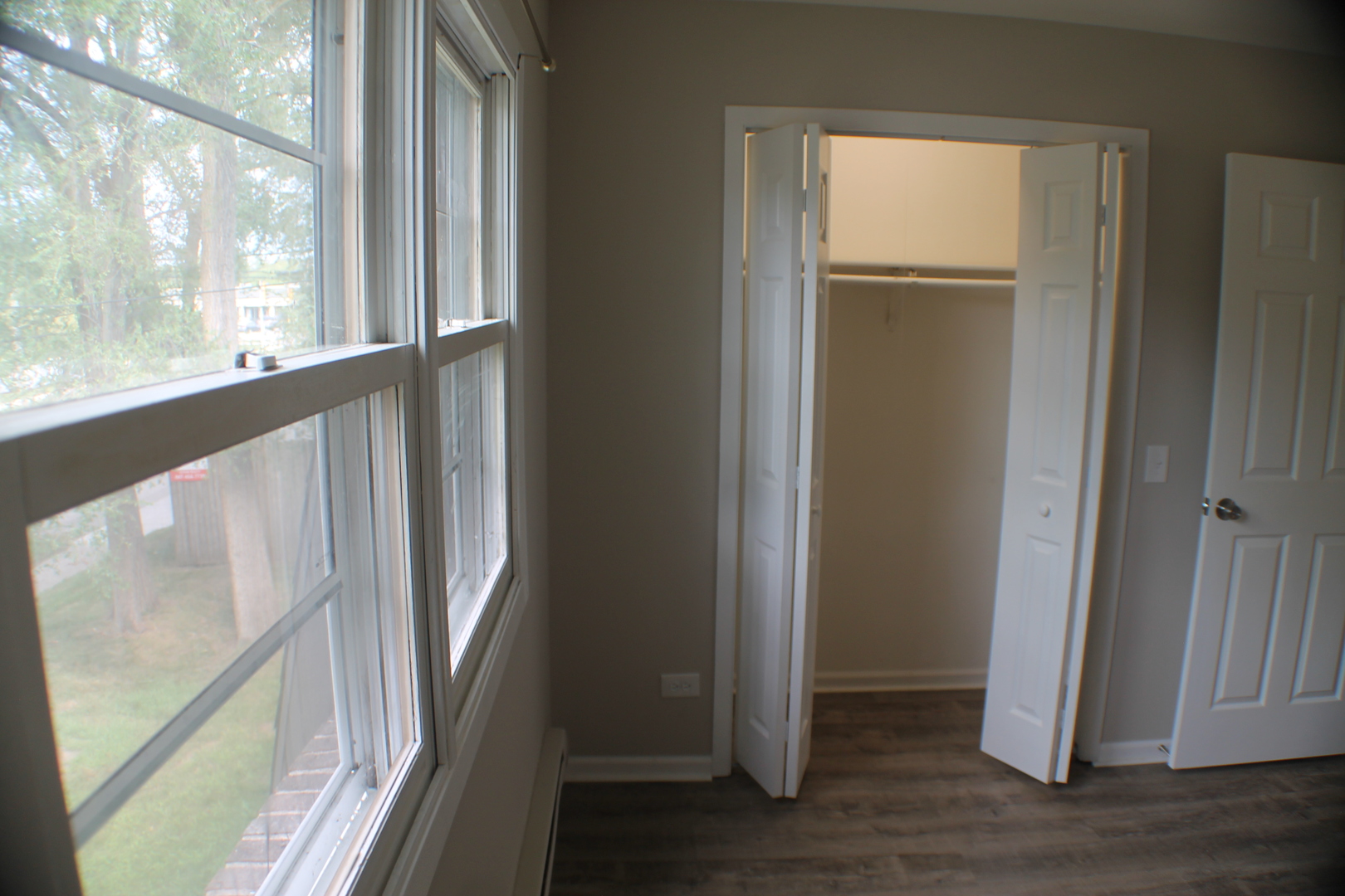 a view of front door with wooden floor