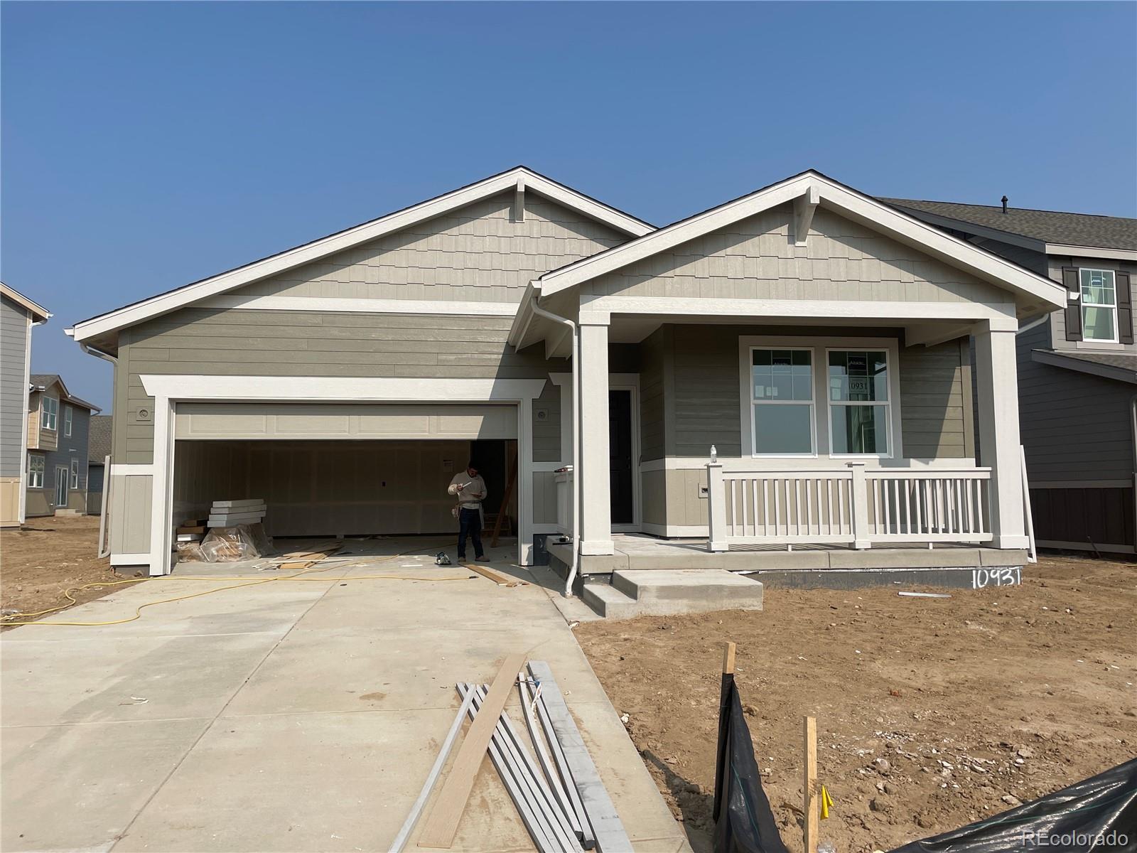 a view of house with deck and a yard