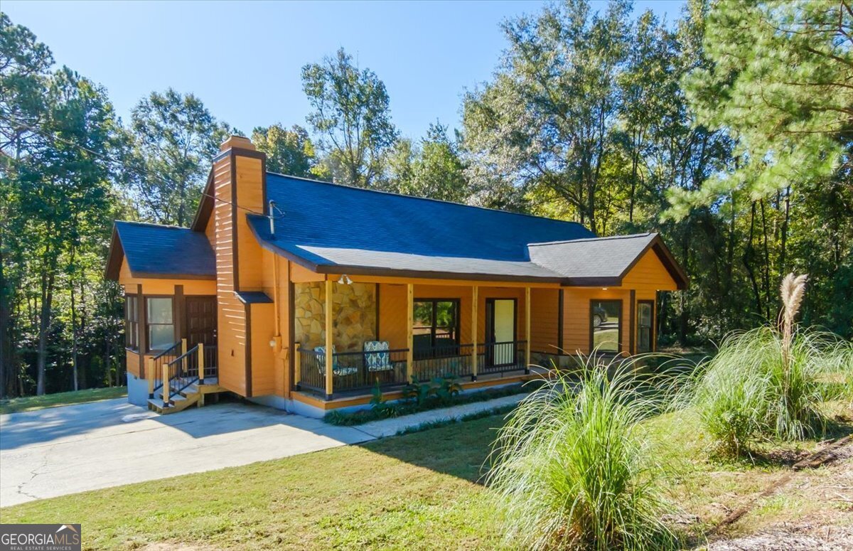 a view of house with yard