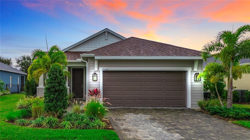 a front view of a house with garage