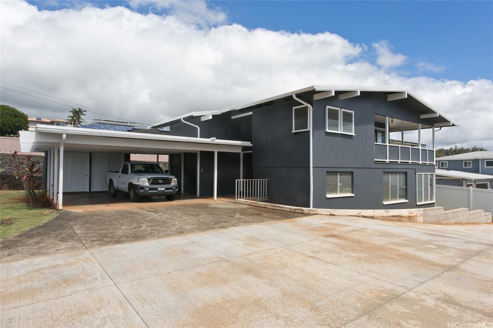 a view of house with outdoor space and sitting space