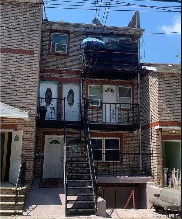 a front view of a house with barbeque grill