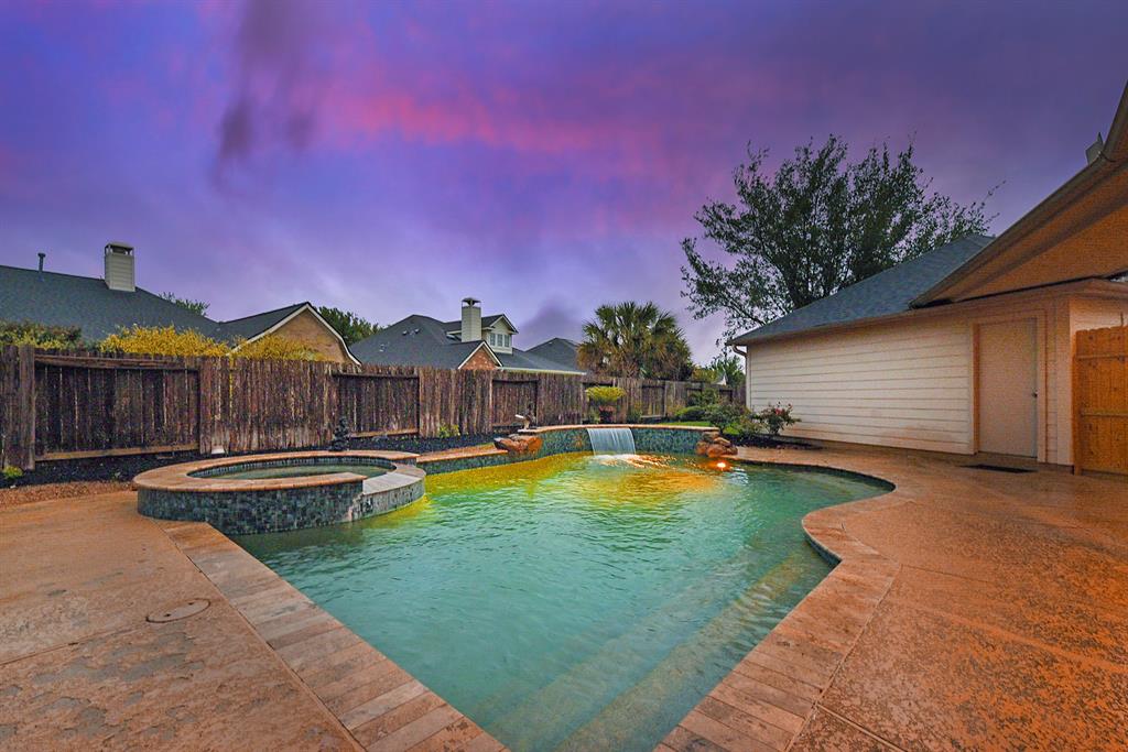 a view of a house with swimming pool and sitting area