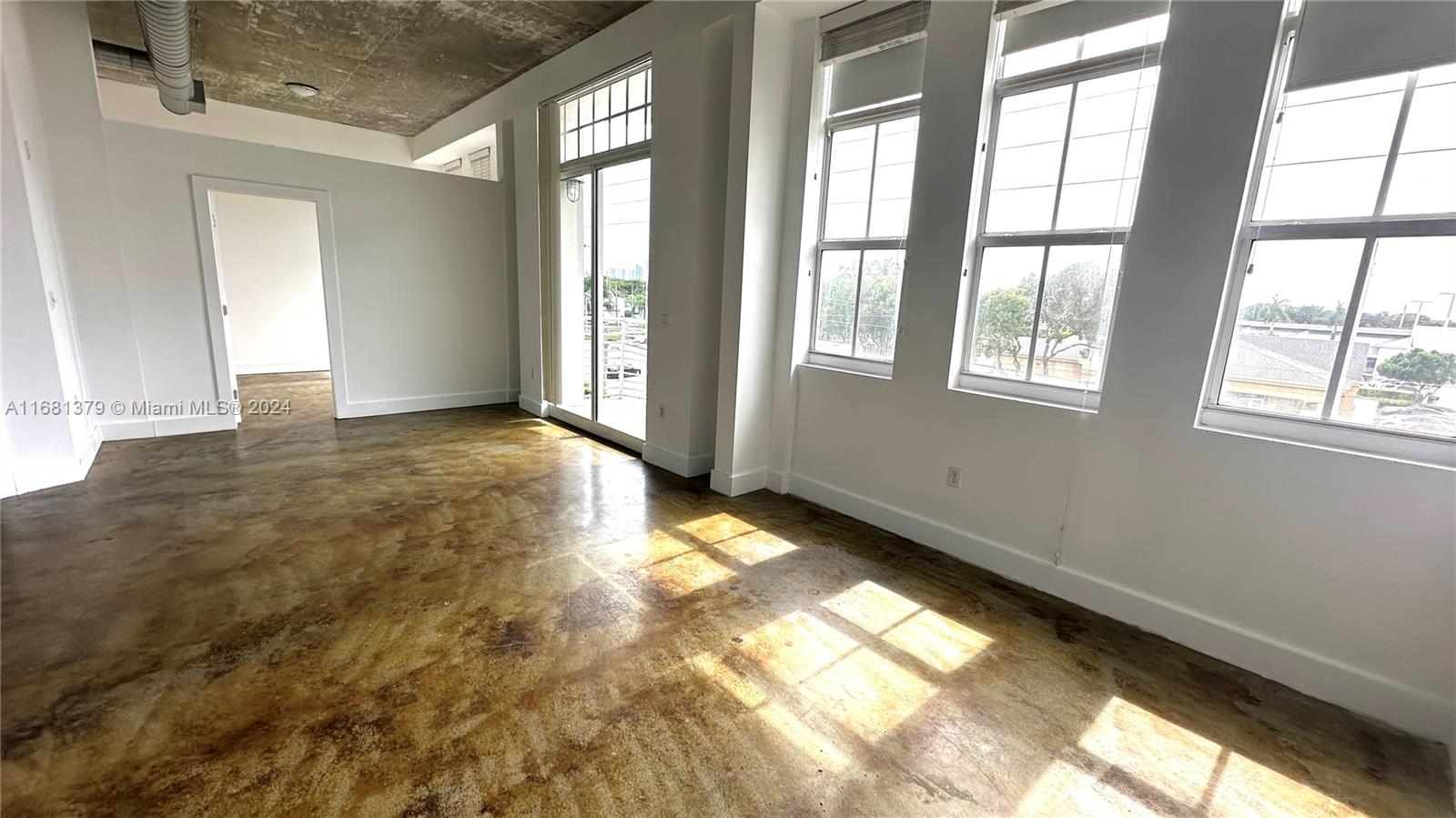 a view of an empty room and window