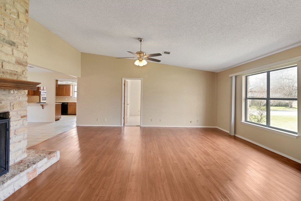 Living/family room has wood laminate flooring.