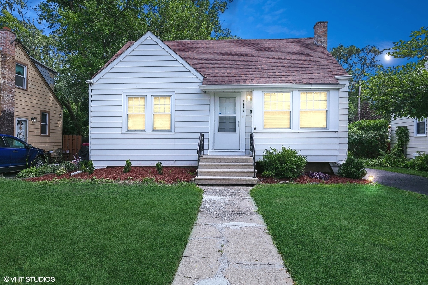 a front view of a house with a yard