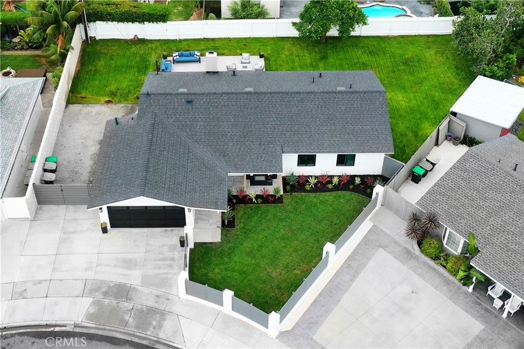 a aerial view of a house with a yard