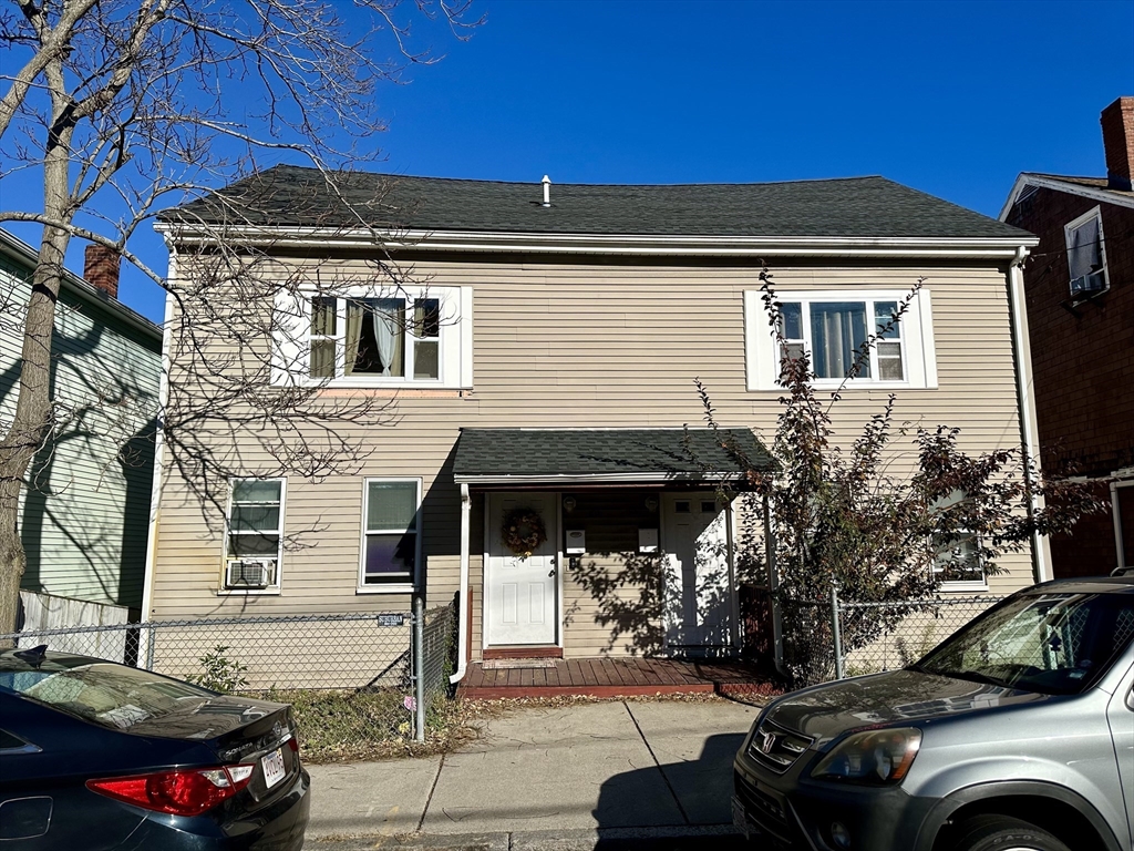 a front view of a house with parking space