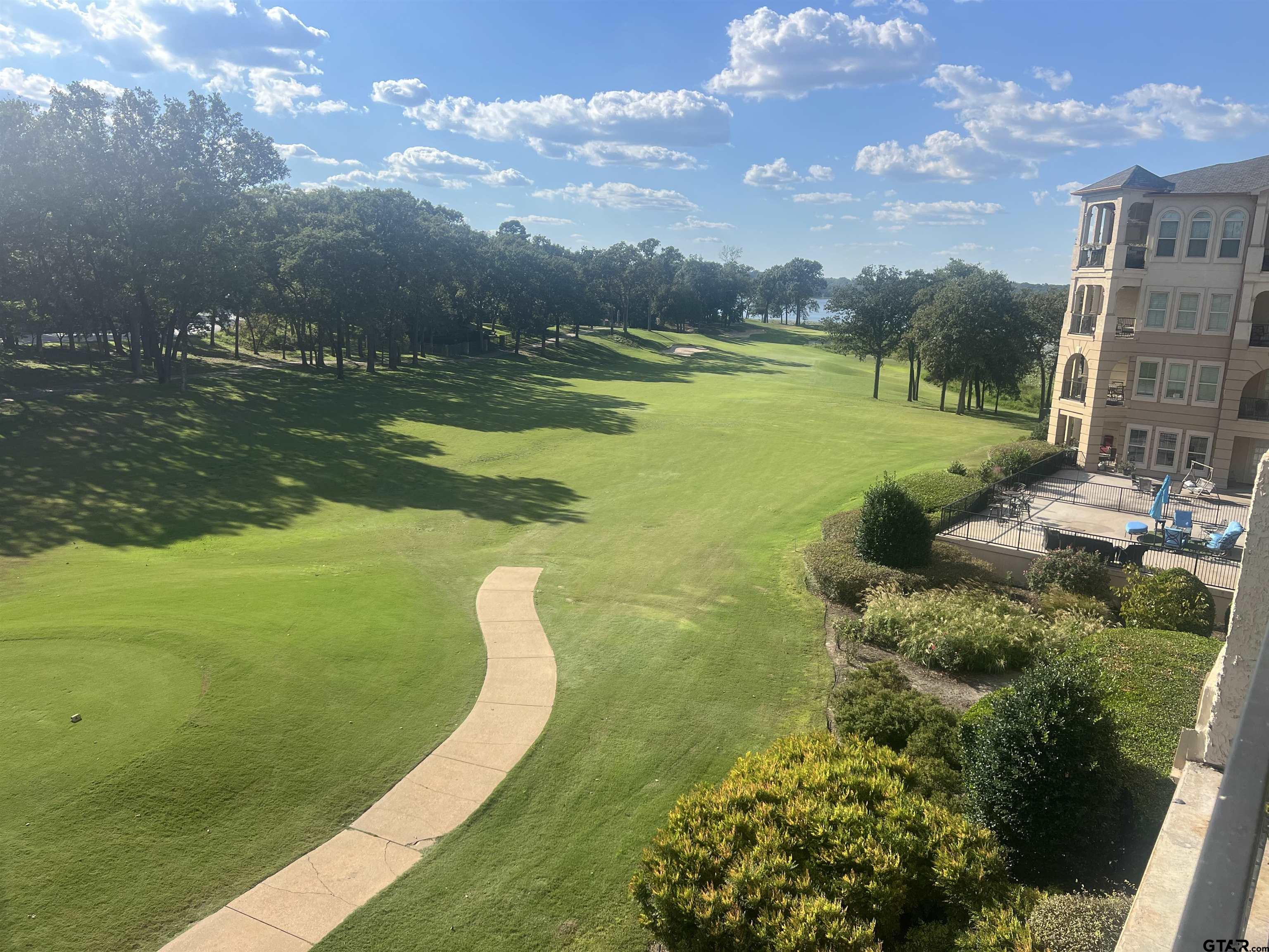 a view of a lake with a big yard