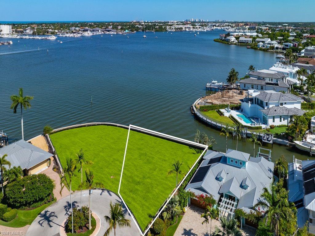 an aerial view of a house with a lake view