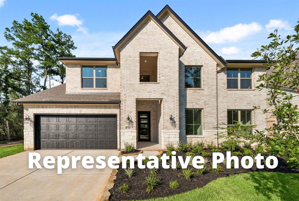 a front view of a house with garage