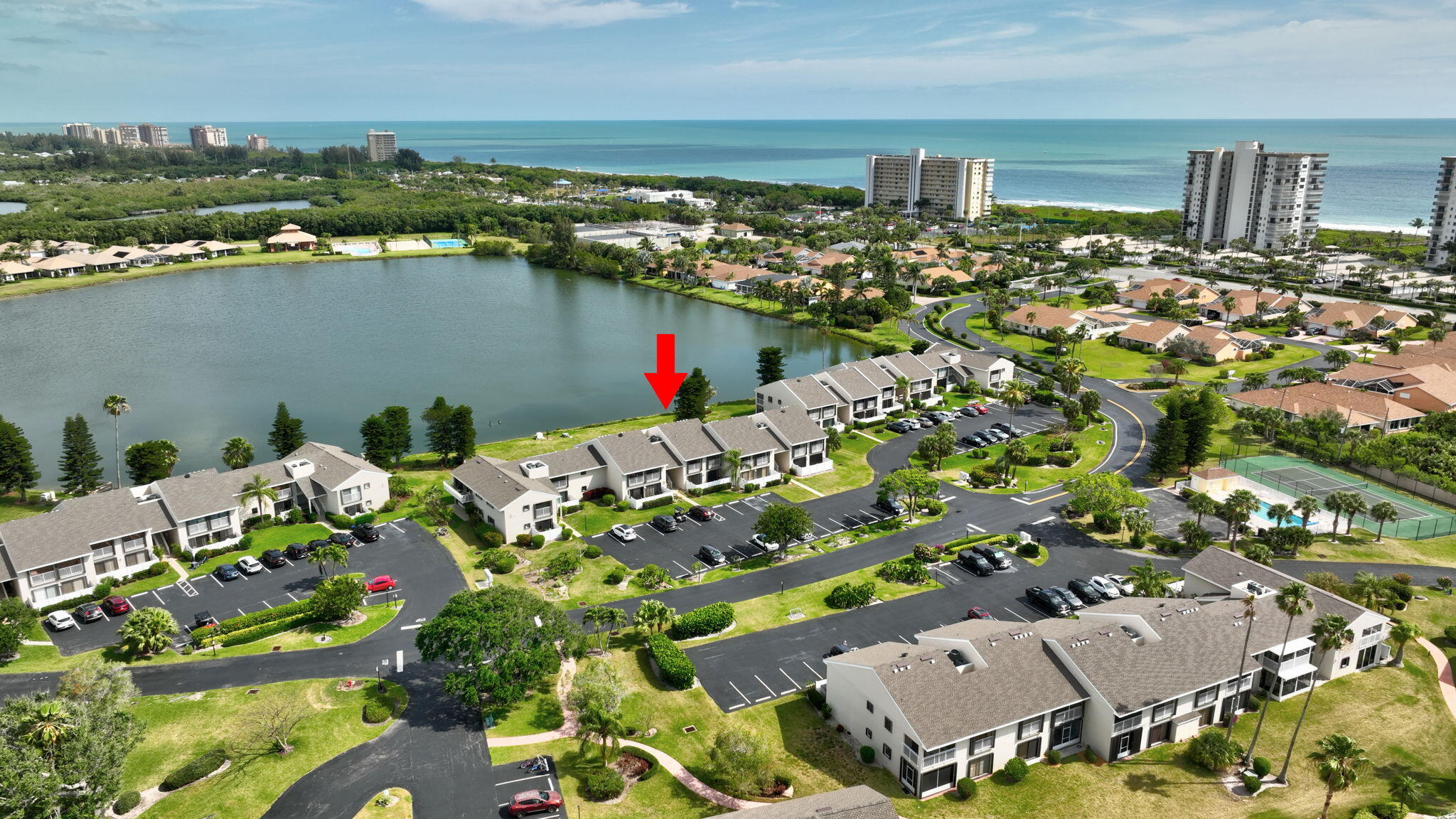 an aerial view of a house with a lake view