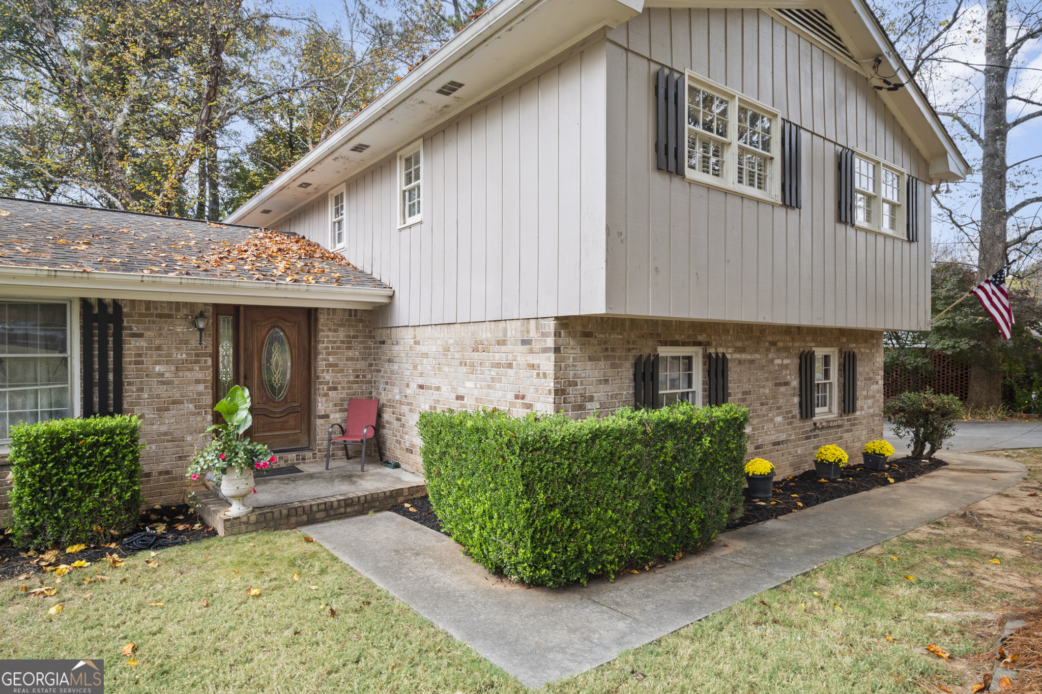 a front view of a house with garden