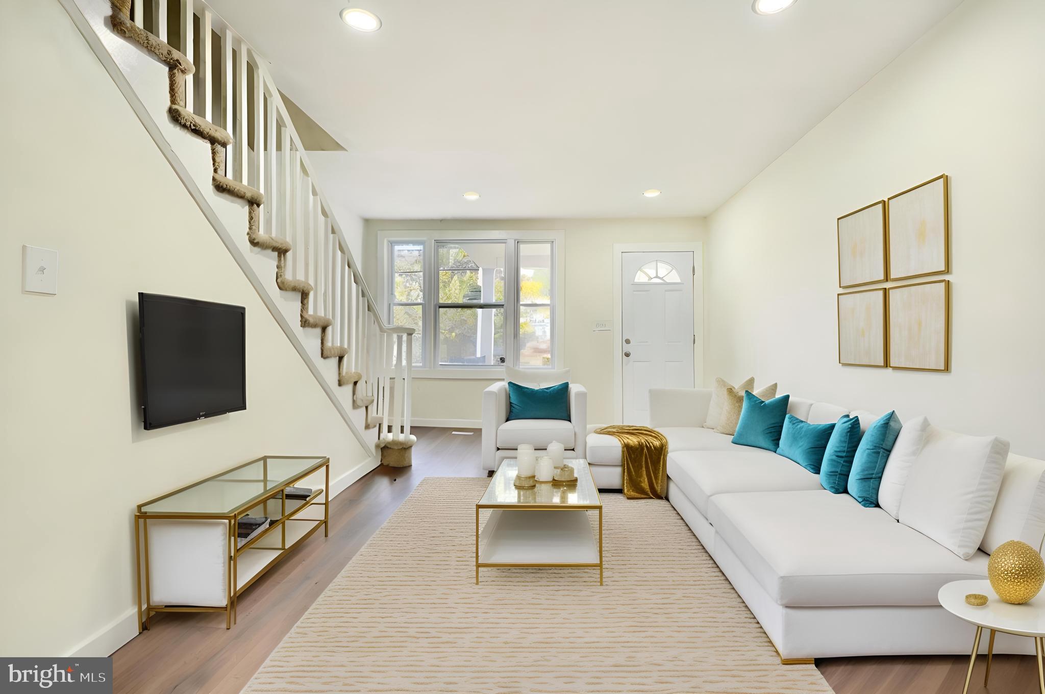 a living room with furniture and a flat screen tv