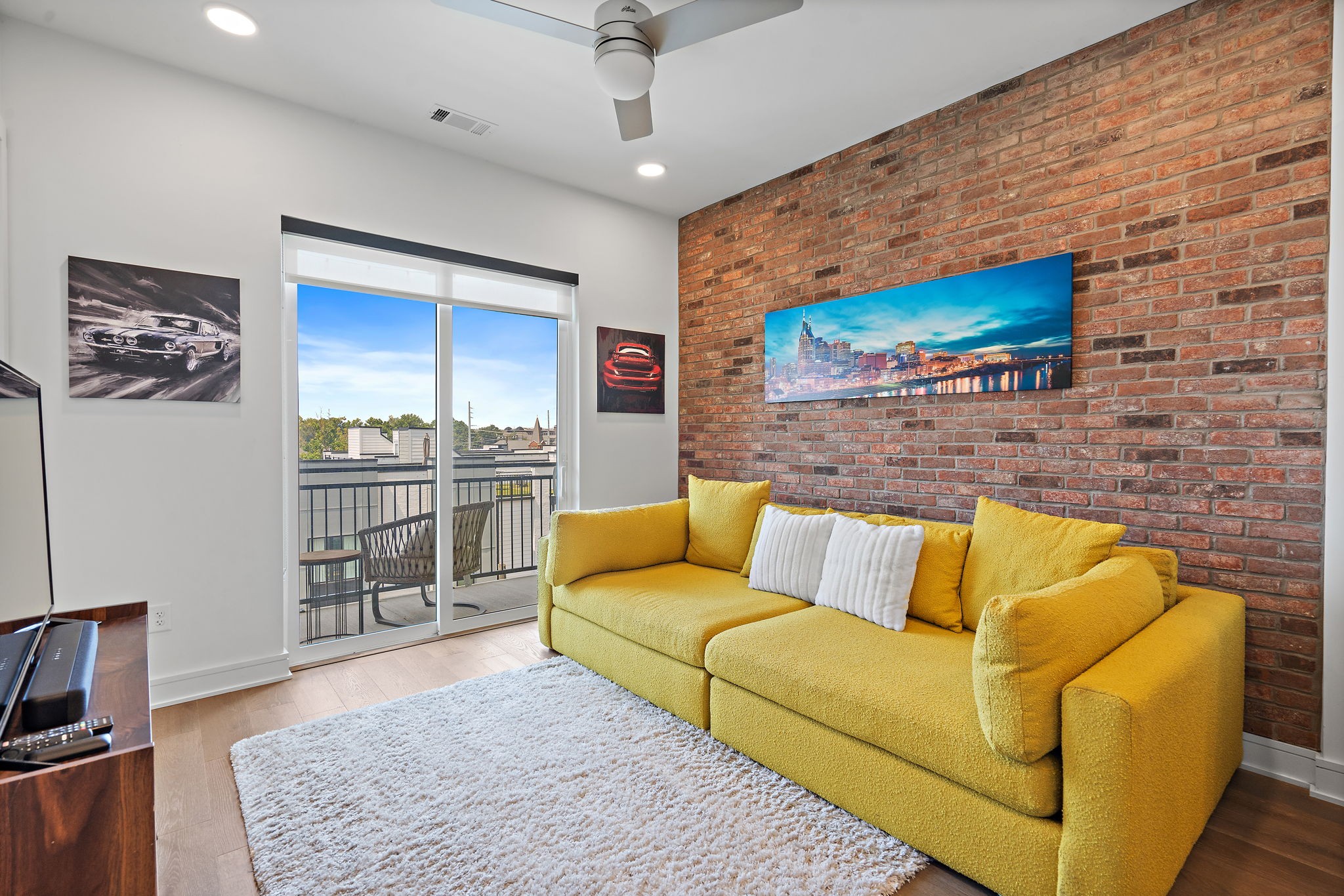 a living room with furniture and a flat screen tv