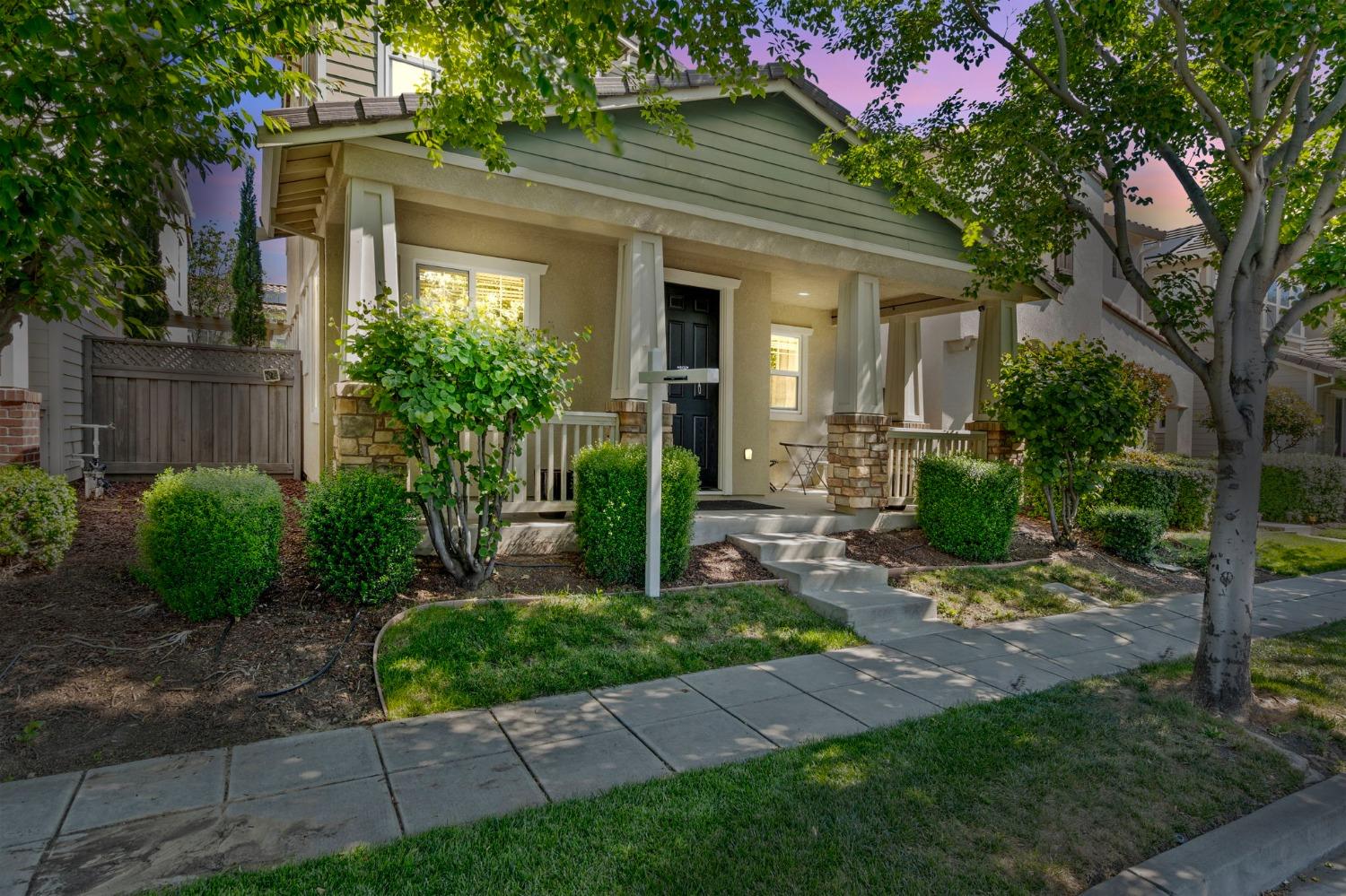 a front view of a house with garden