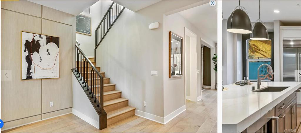 a view of a hallway with entryway wooden floor and front door