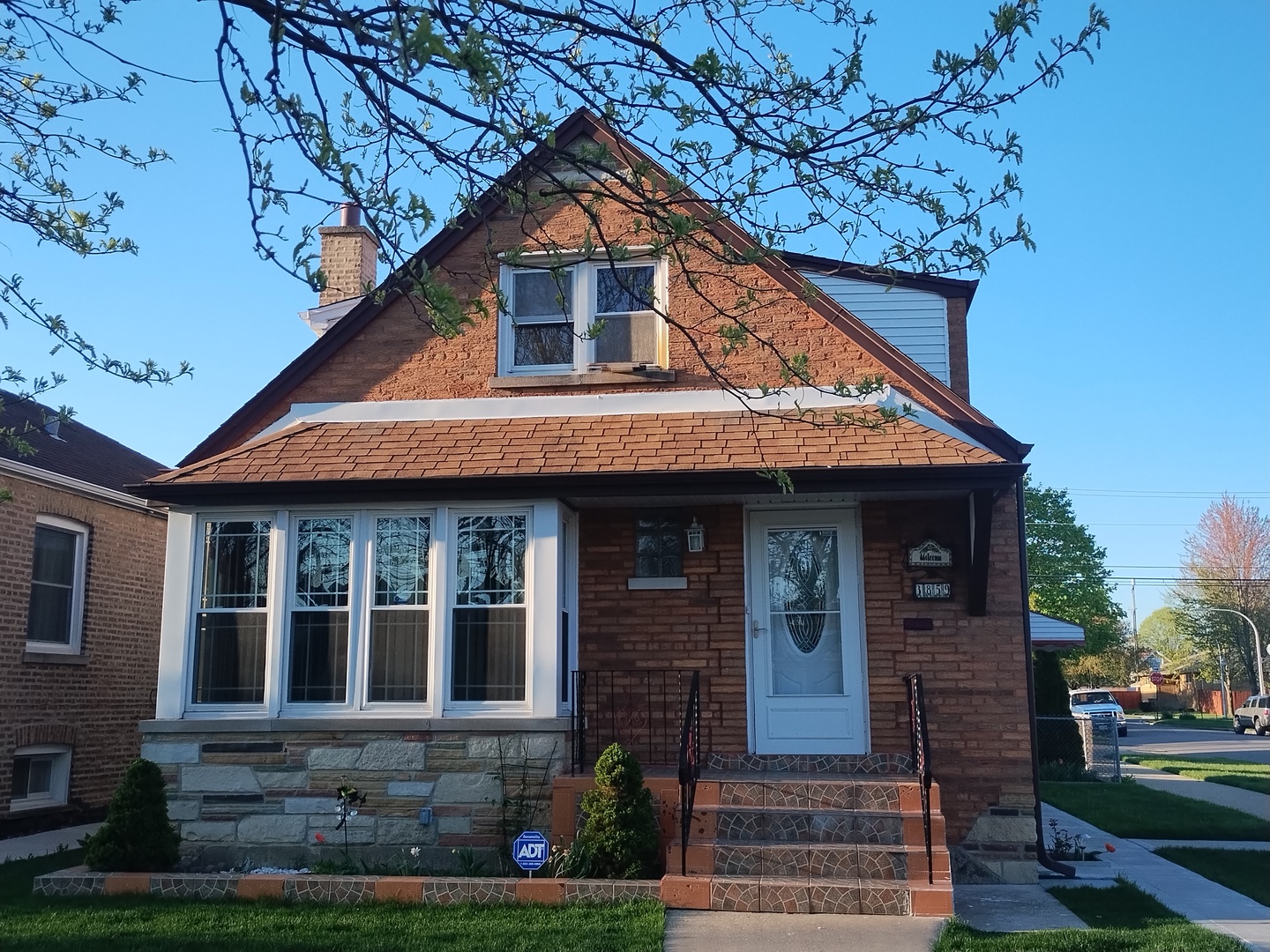 a front view of a house with garden