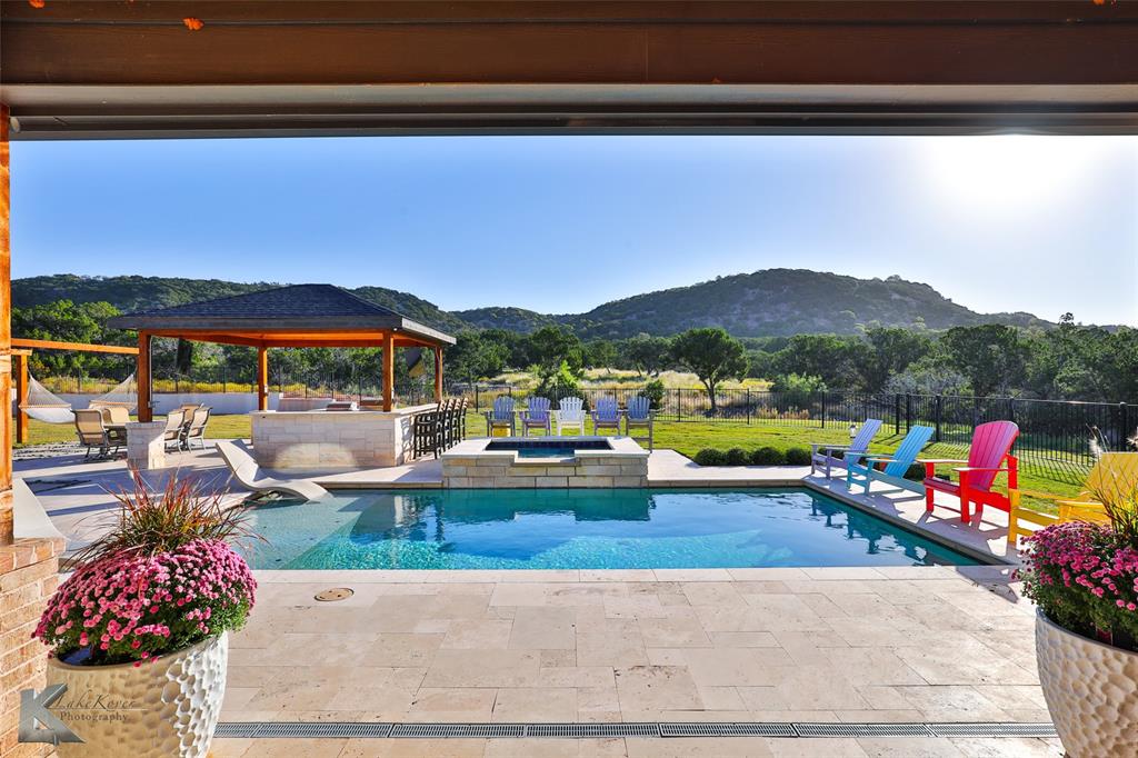 a view of swimming pool with a patio