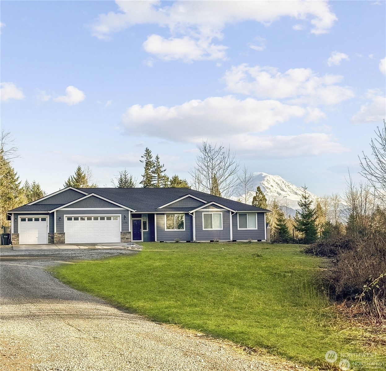 a front view of house with yard and green space