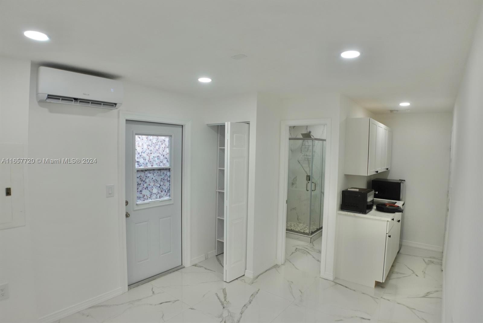 a view of a storage & utility room with a sink