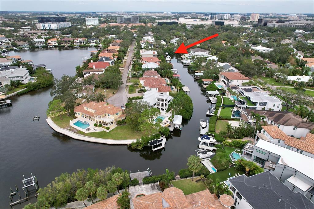 an aerial view of a house with a lake view