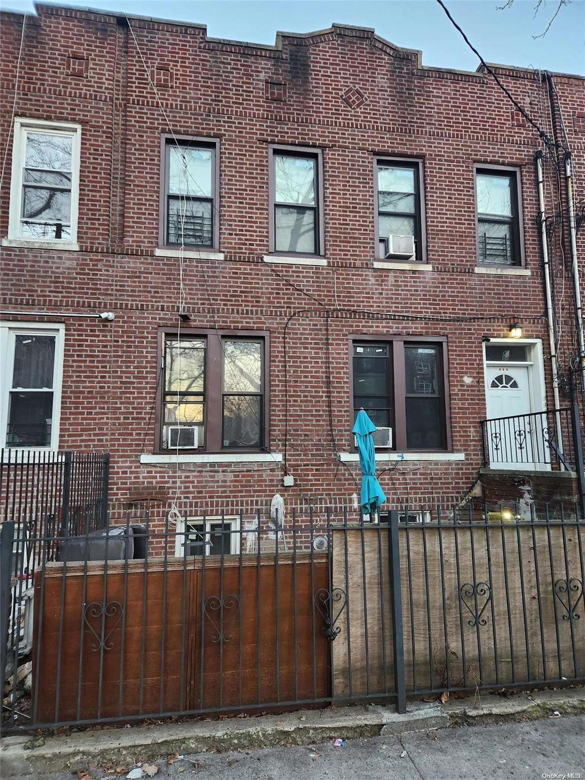 a front view of a house with glass windows