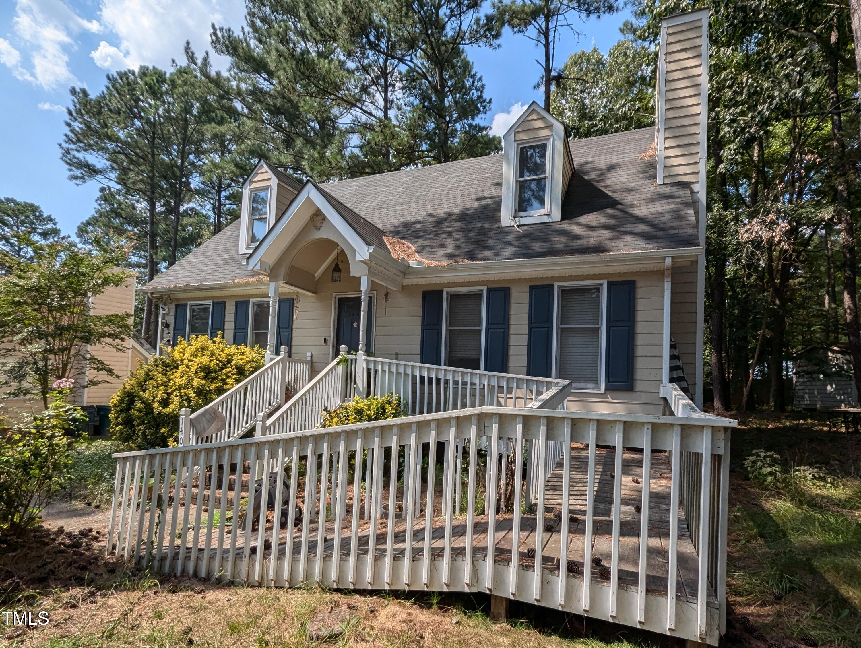 a front view of a house with a deck