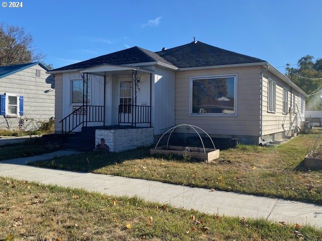 a front view of a house with yard