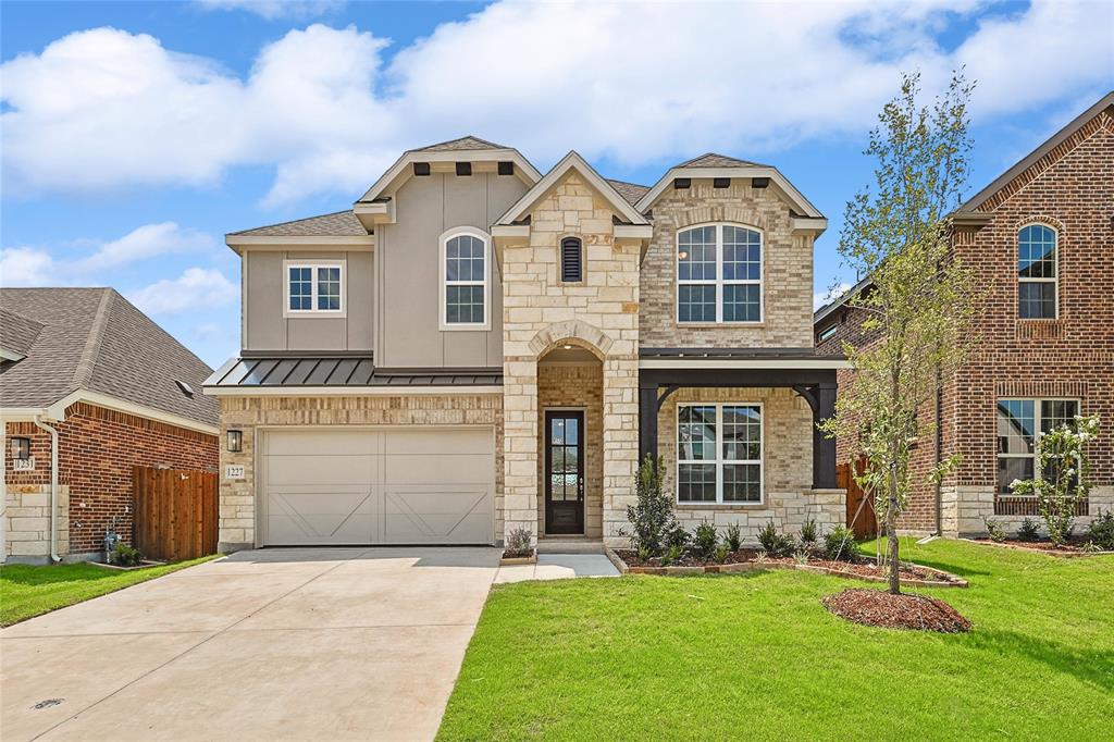 front view of a house with a yard