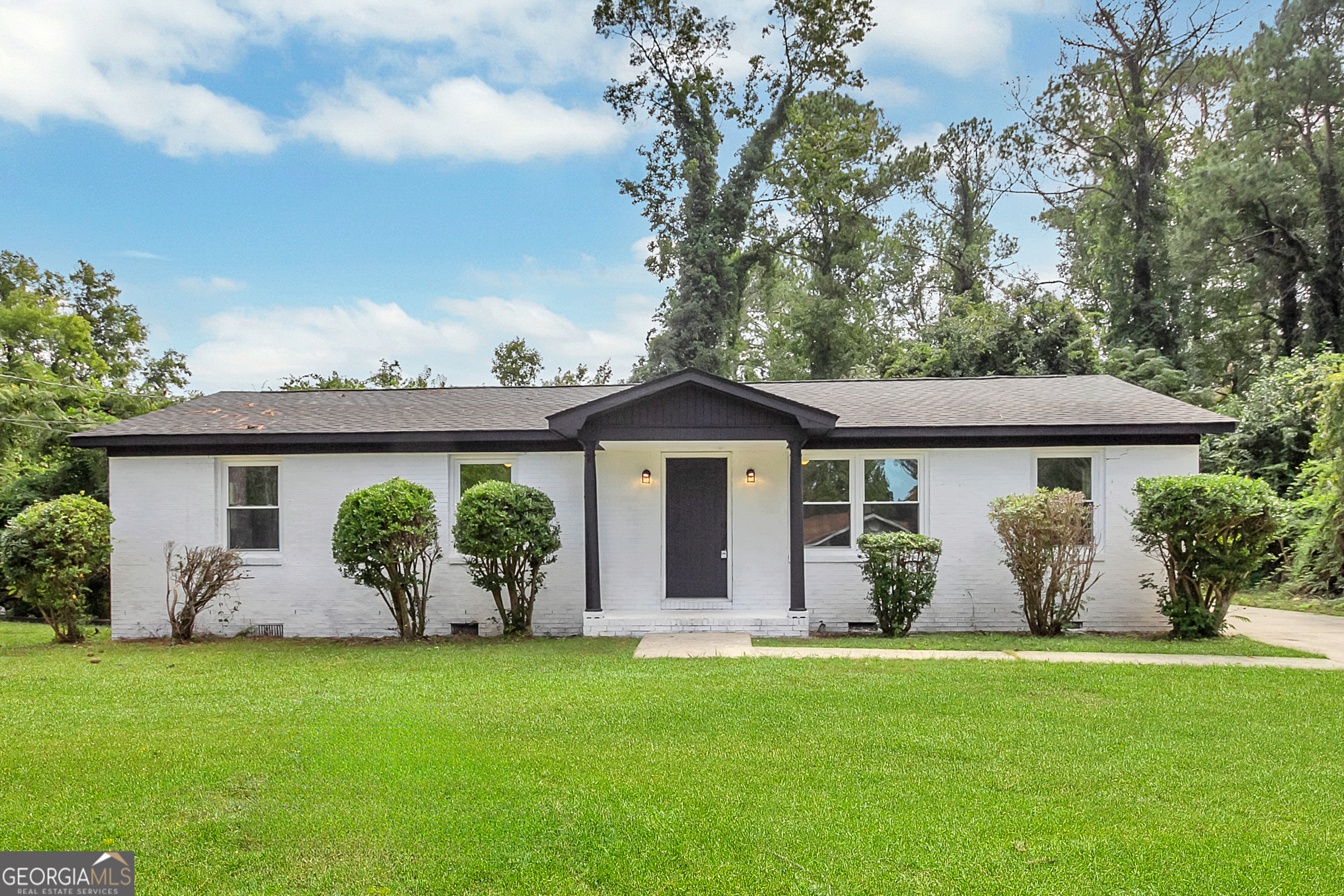 front view of a house with a yard