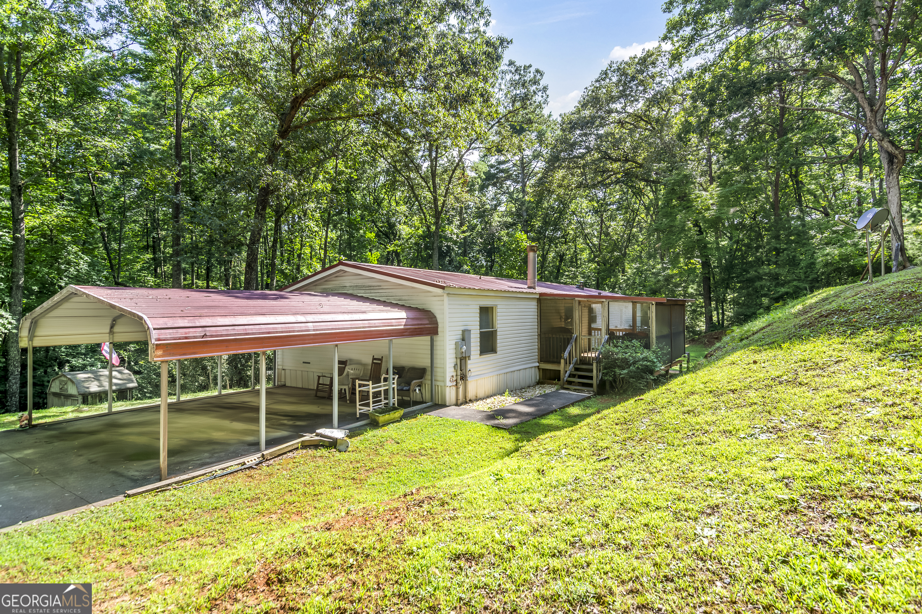 a view of a house with a yard porch and sitting area