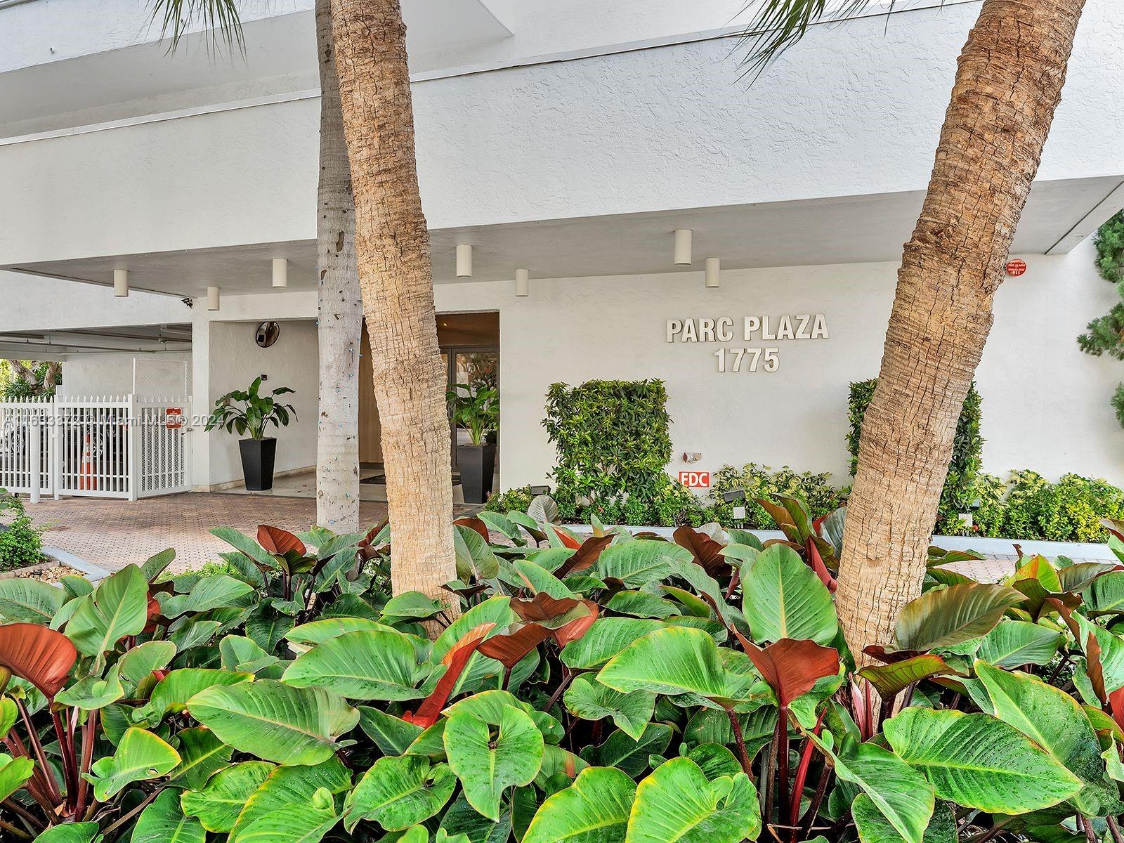 a picture of flowers in front of building