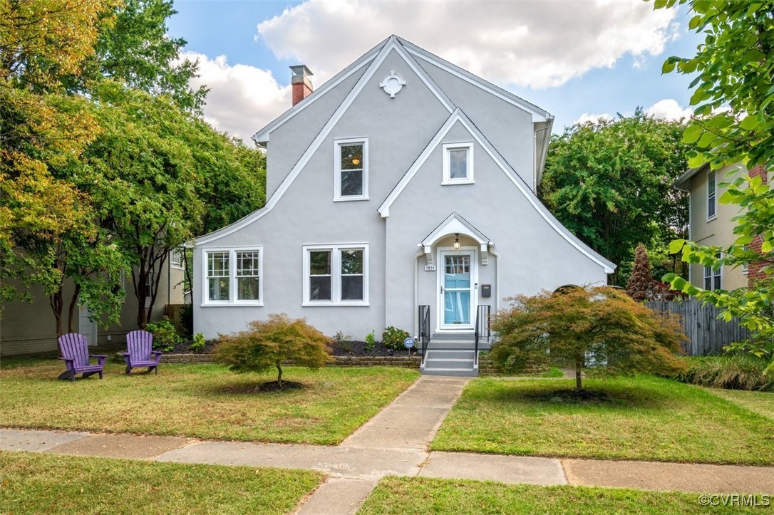 a front view of a house with a yard