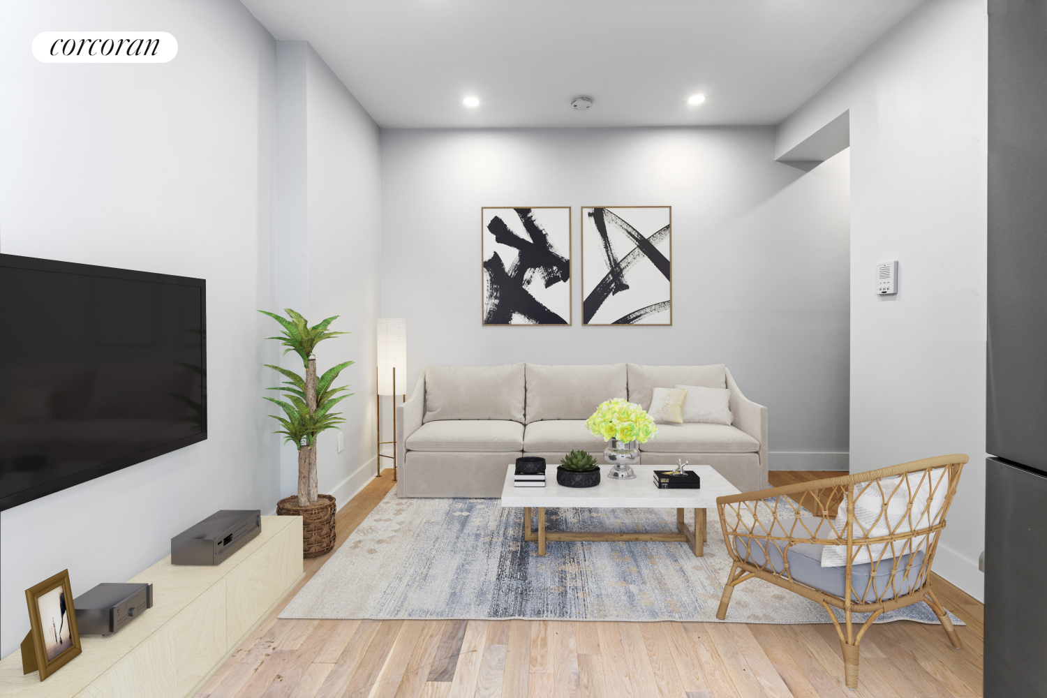 a living room with furniture and a flat screen tv