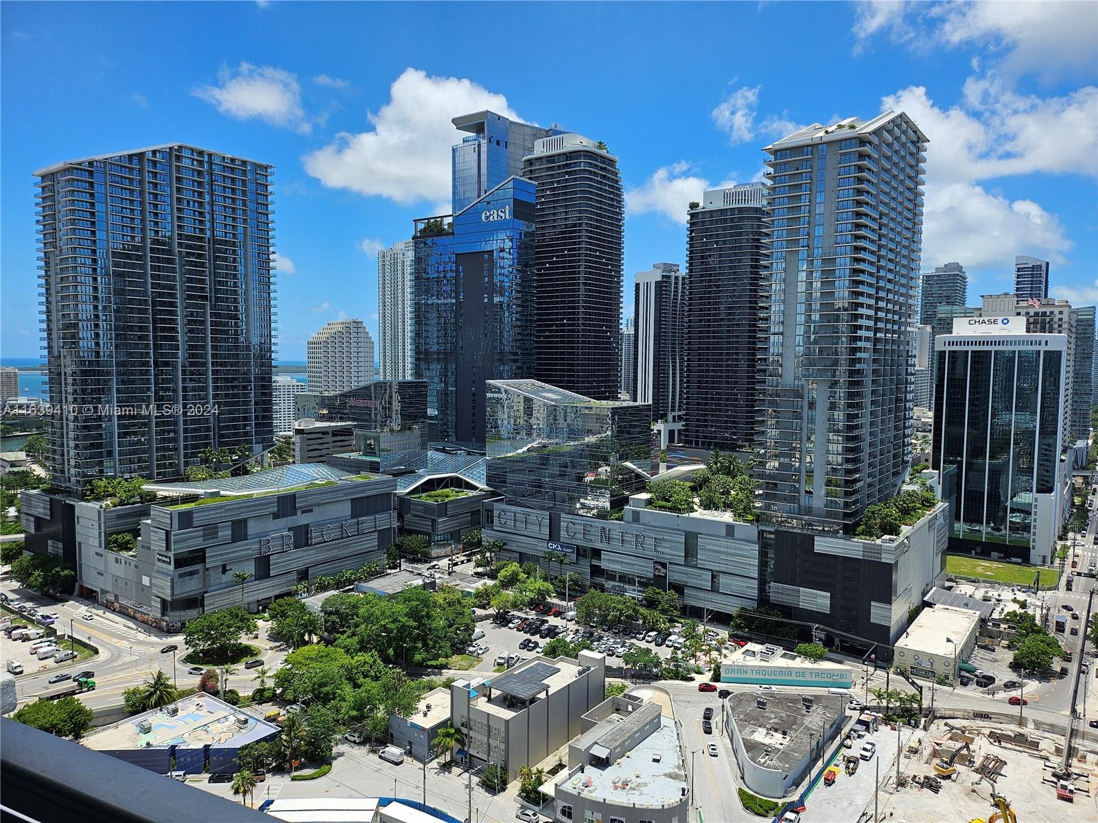 a city street filled with lots of tall buildings