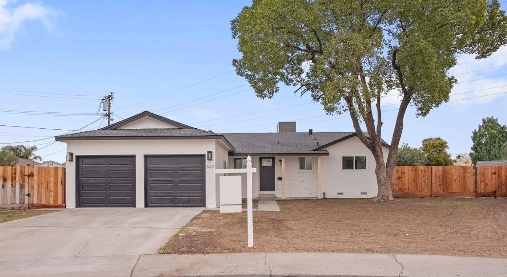 a front view of a house with garage