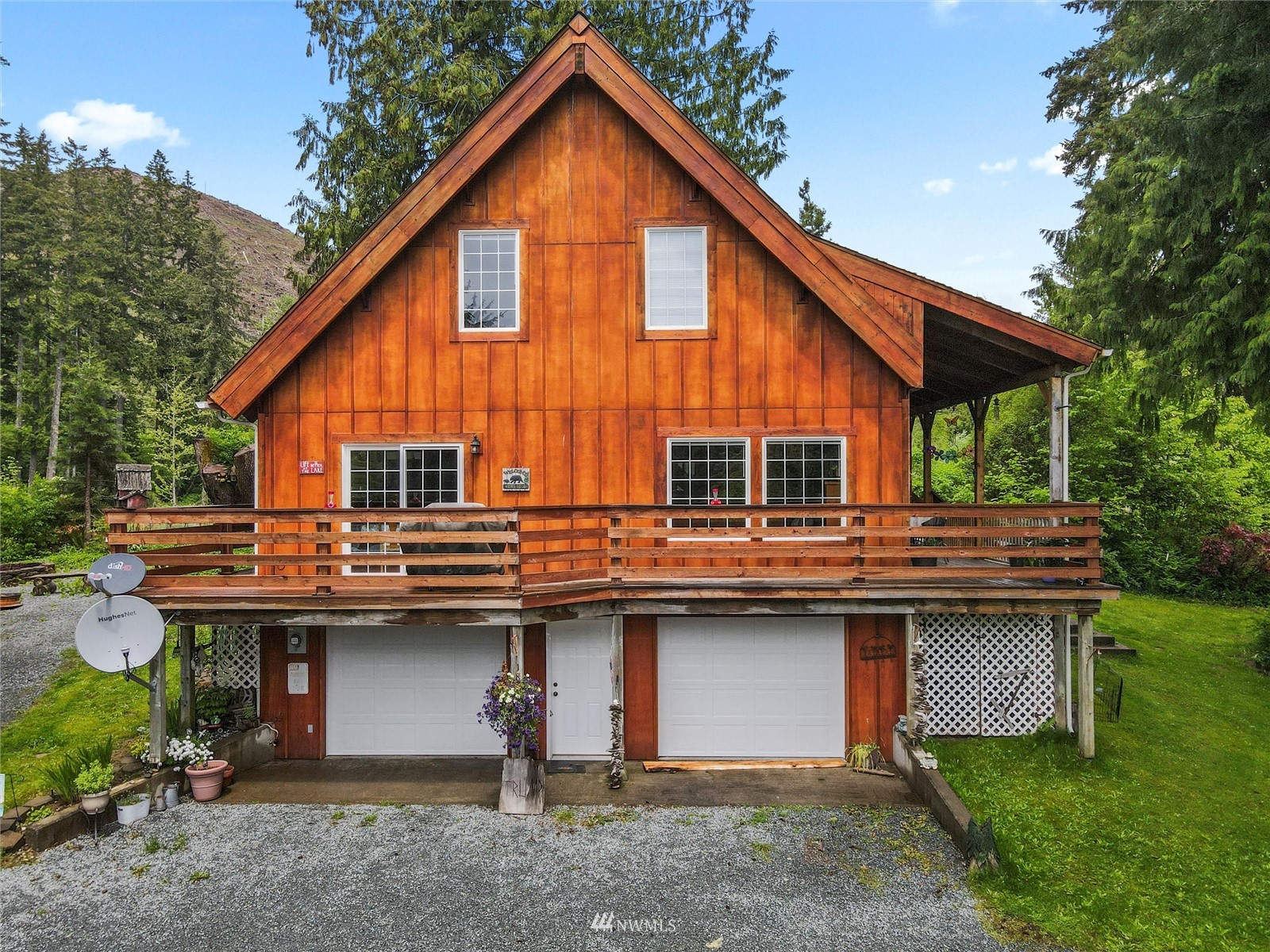 a view of house with backyard and seating space