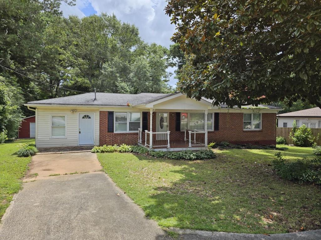 a view of a house with a yard