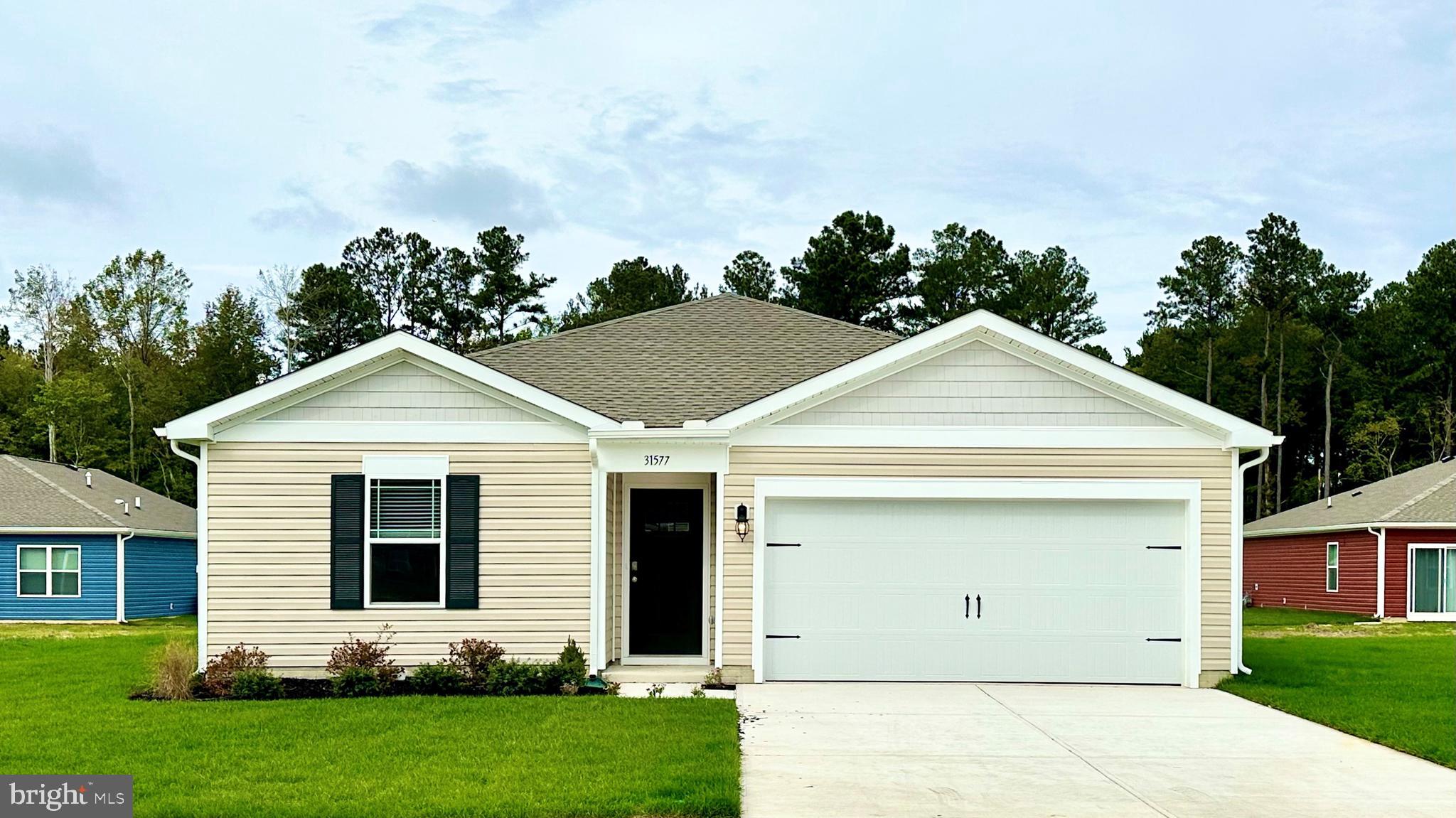 front view of a house with a yard