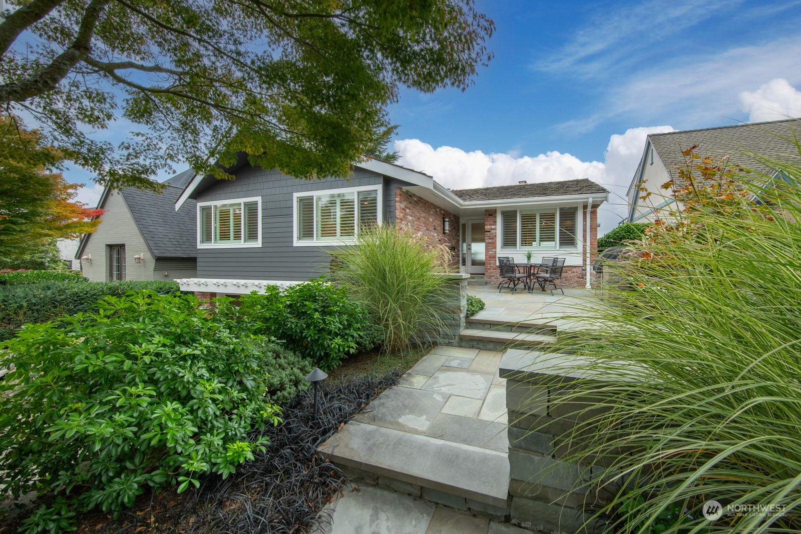 a front view of a house with garden