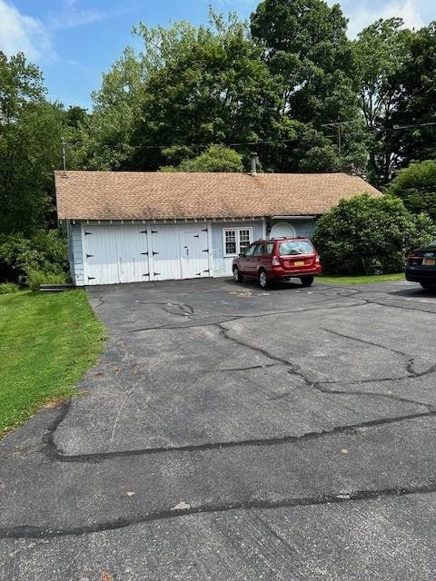 a view of a car parked in front of a house