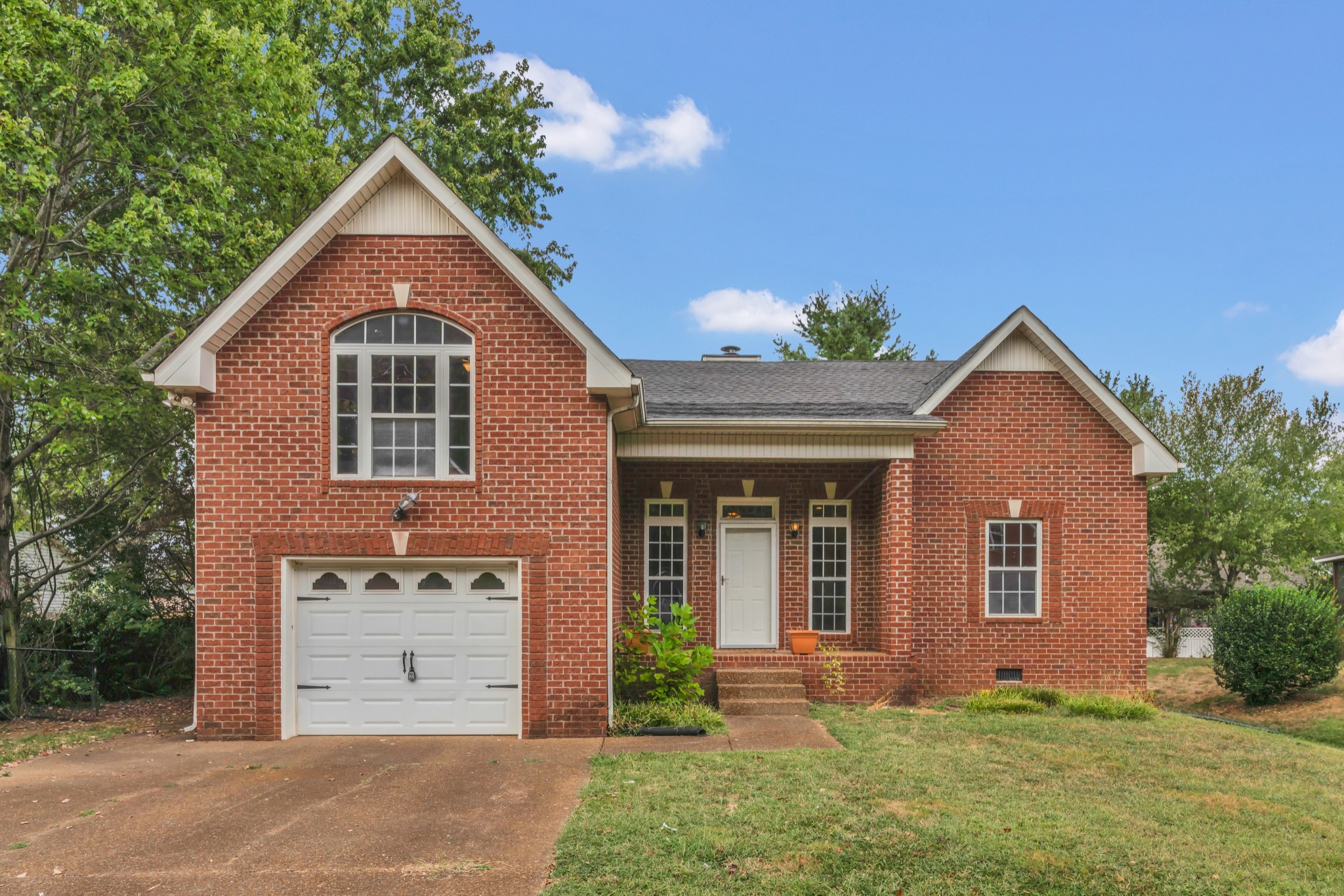 front view of a house with a yard