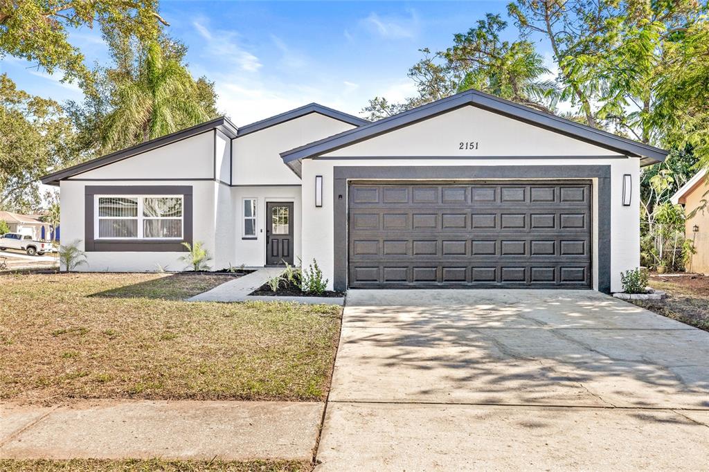 a front view of a house with garage