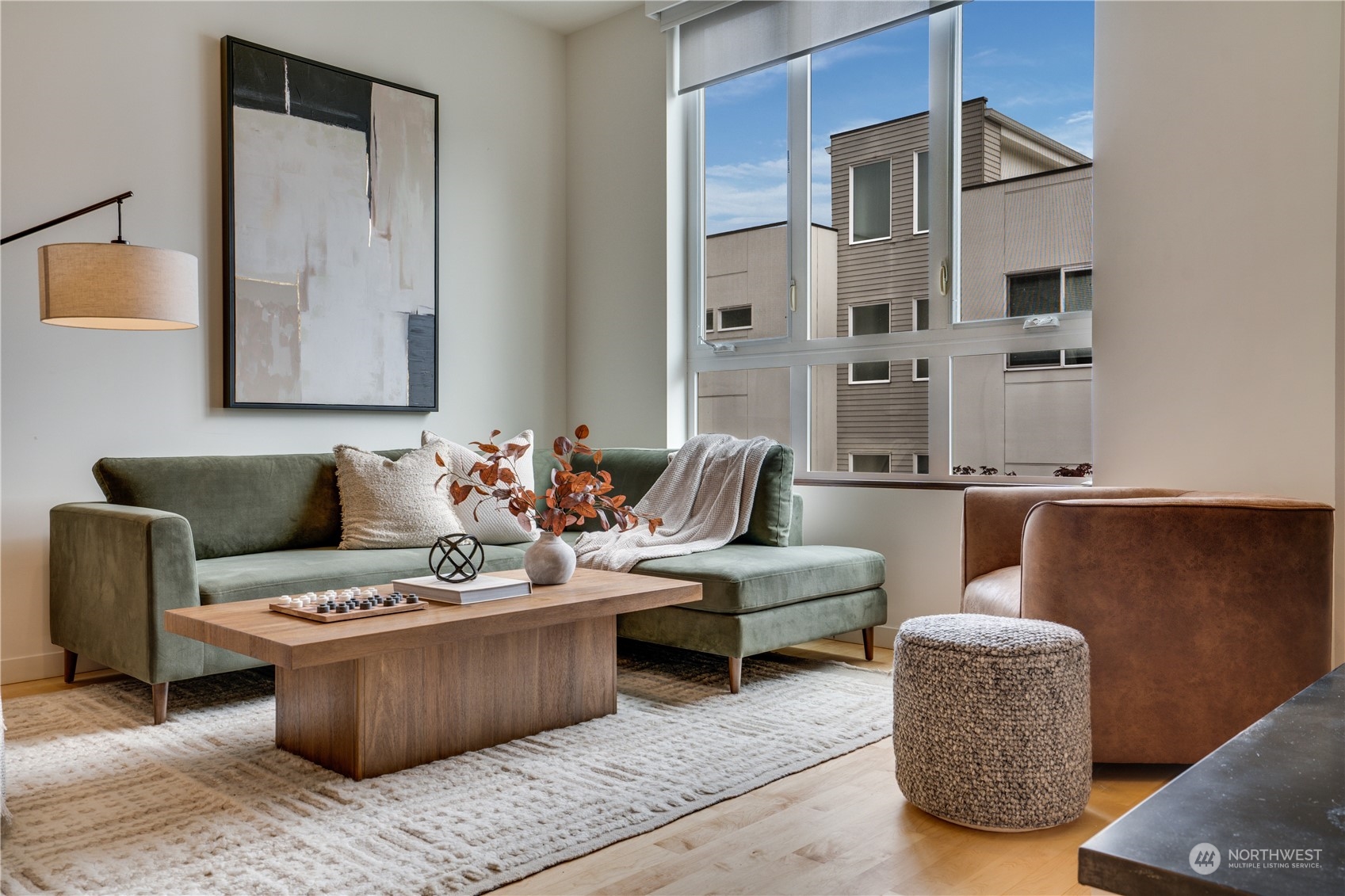 a living room with furniture and a lamp