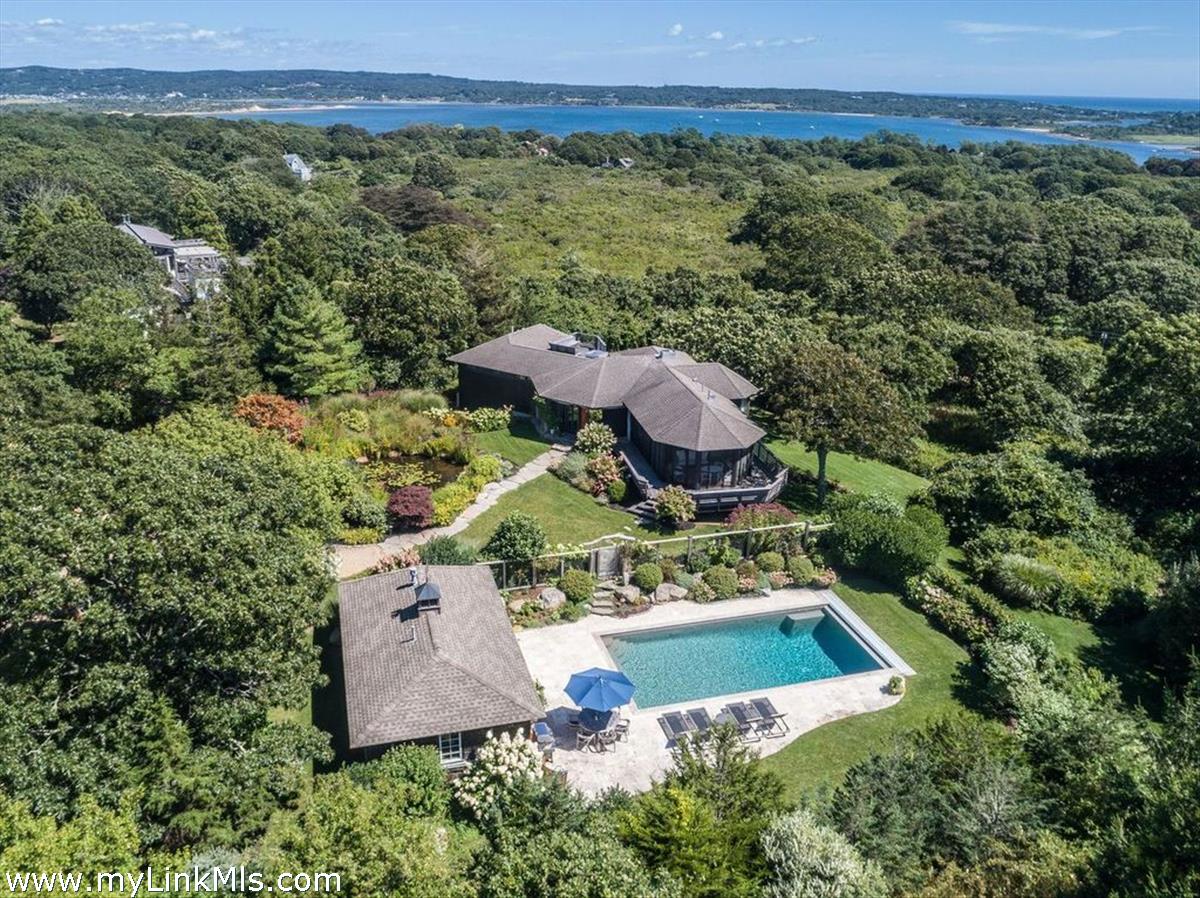 an aerial view of a house with a garden